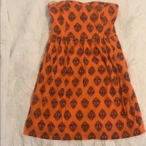 Orange with navy detail sweetheart neckline dress.